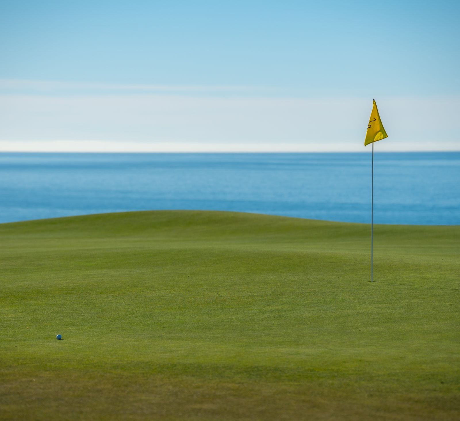 Links golf course green overlooking the ocean